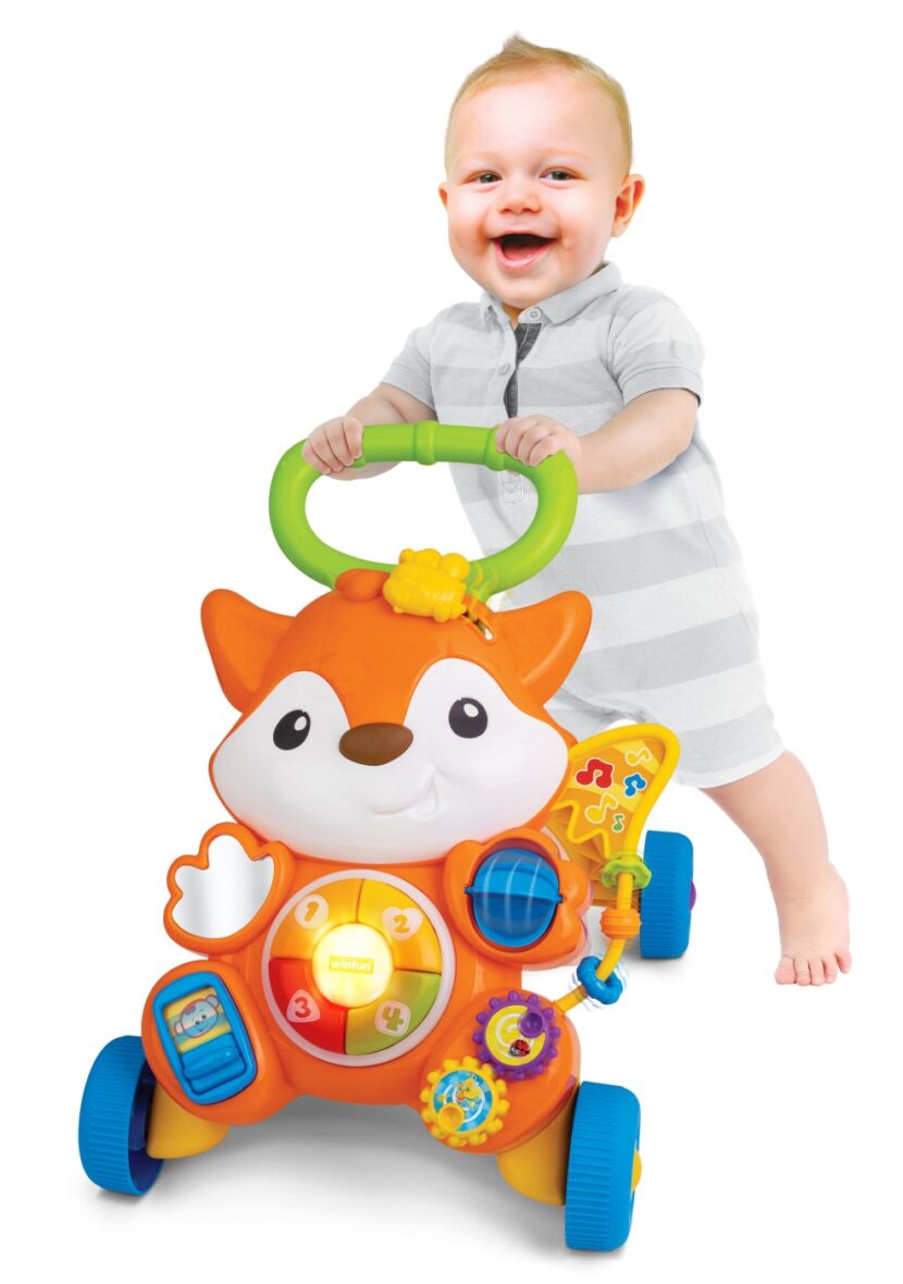 Cute,Baby,Playing,With,Toy,Walker,,Indoors